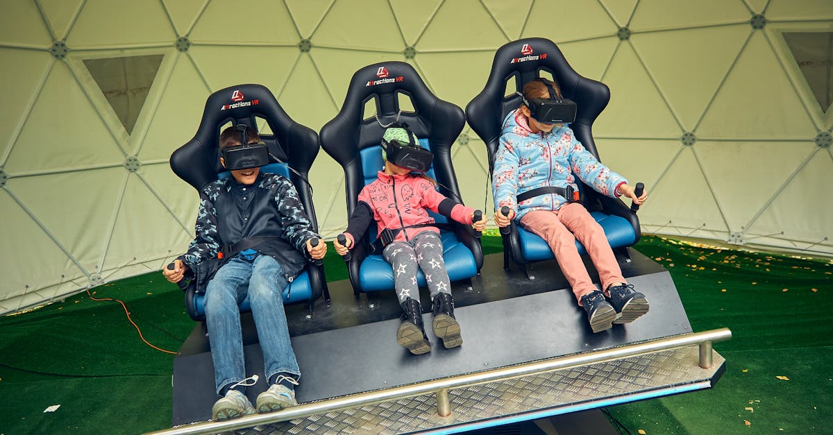 Three kids enjoy virtual reality in a VR simulator with headsets.