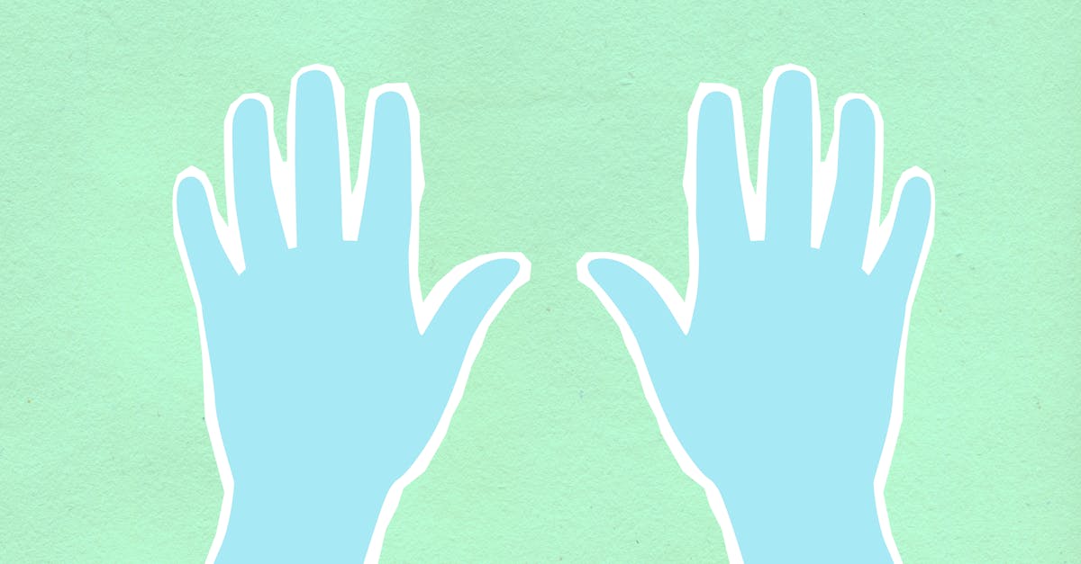Top view of decorative cardboard illustration representing hands in disposable gloves on green background