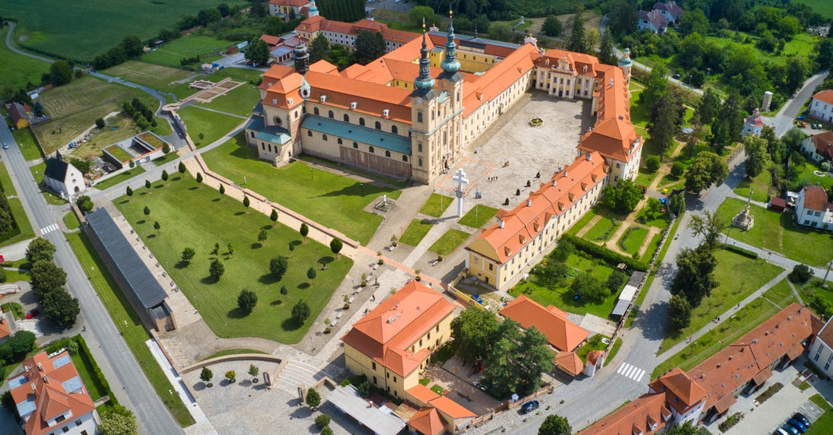 Discover the stunning aerial view of Velehrad Monastery with lush greenery and historic architecture.