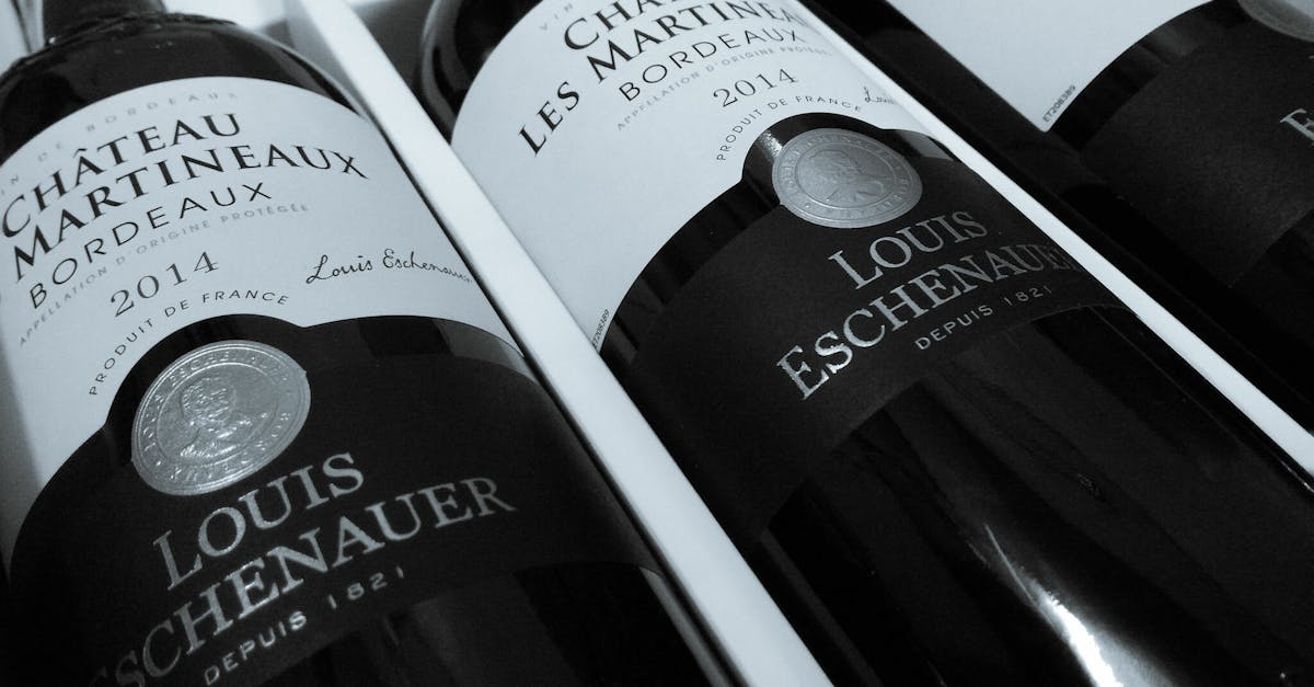 Close-up of Château Martineaux Bordeaux wine bottles highlighting elegance and luxury.