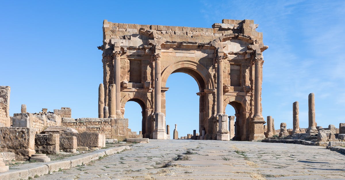 Explore the ancient Roman triumphal arch in Timgad, a UNESCO World Heritage Site in Algeria.