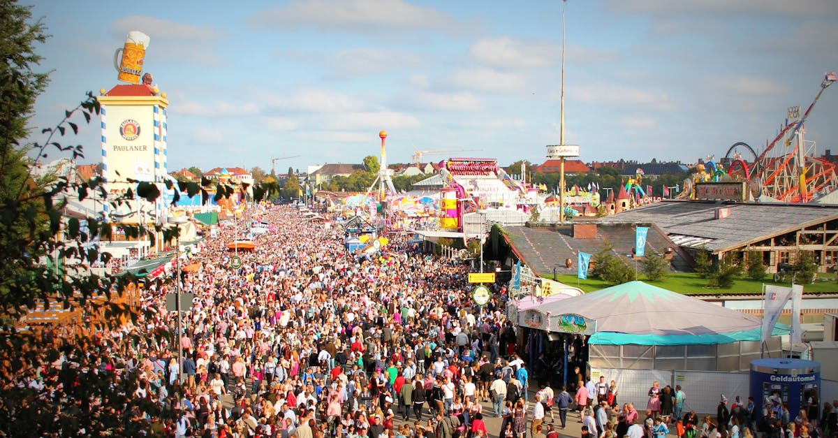 A lively scene at Oktoberfest in Munich with a massive crowd enjoying the festivities and attractions.